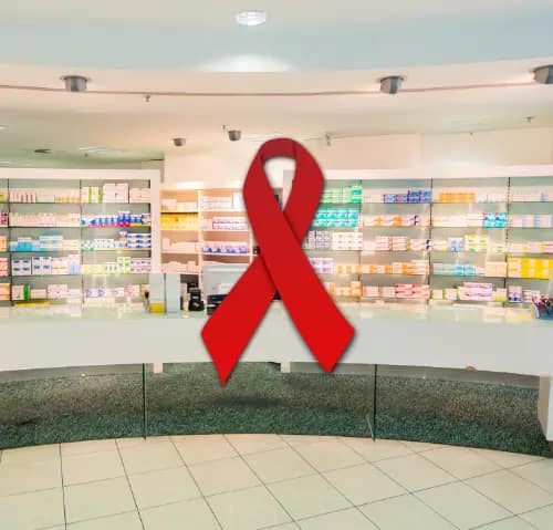 Rote HIV-Solidaritätsschleife im Verkaufsraum von Axels Apotheke